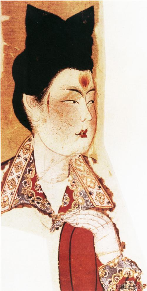 《胡服美人图》中面涂额黄的唐代女子